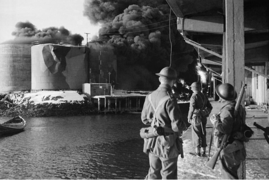 British commandos watching industrial oil tanks burn during Operation Claymore on the Lofoten Islands, March 1941.