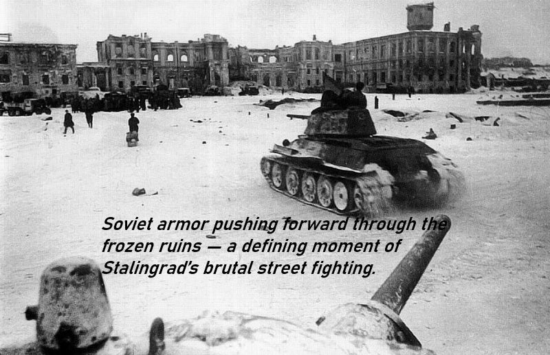 Winter battlefield scene with a Soviet T‑34 tank advancing through snow‑covered ruins during intense urban combat.