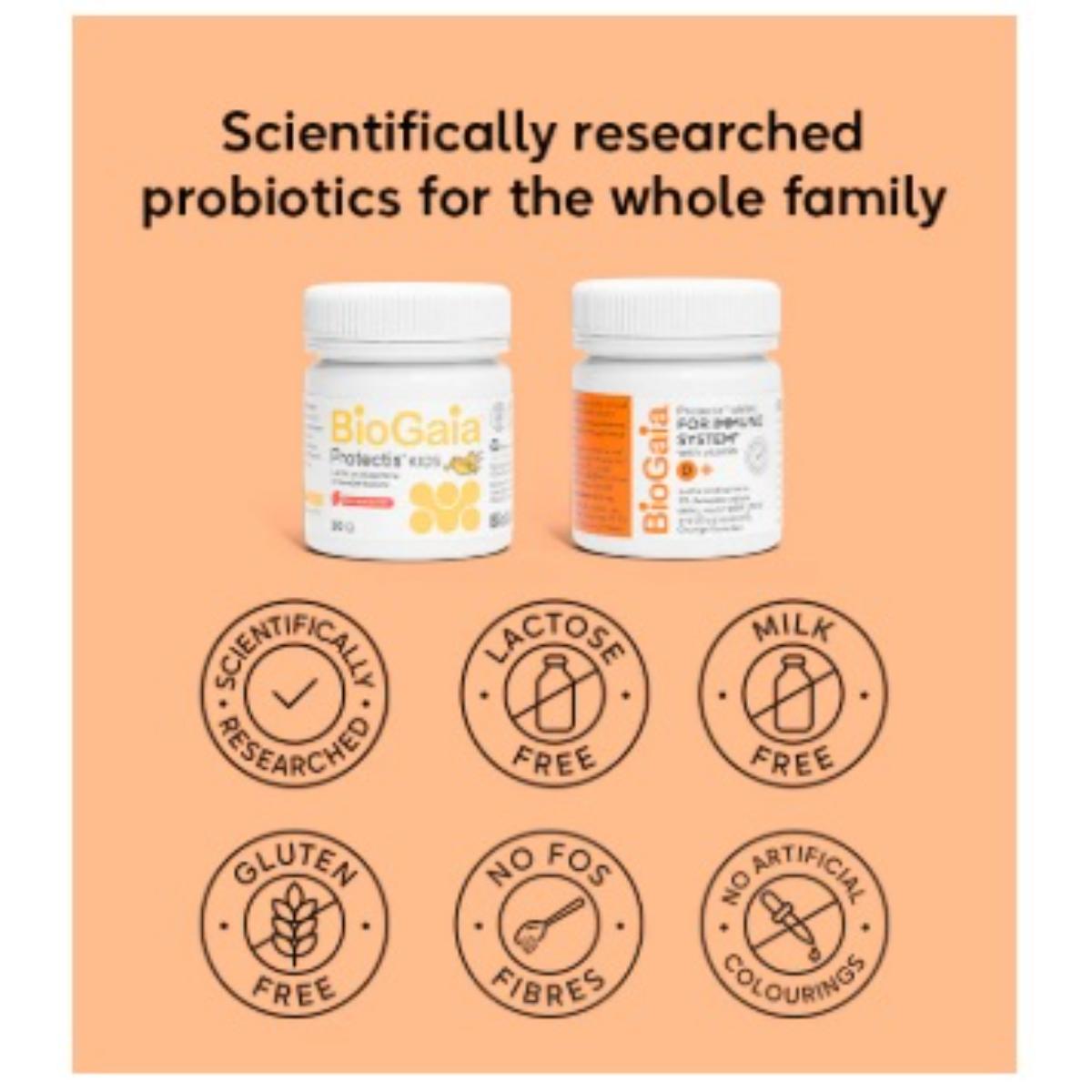 Two BioGaia probiotic supplement bottles displayed on a peach-colored background with promotional text and six circular badges highlighting product features such as scientifically researched, lactose free, milk free, gluten free, no FOS fibres, and no artificial colourings.