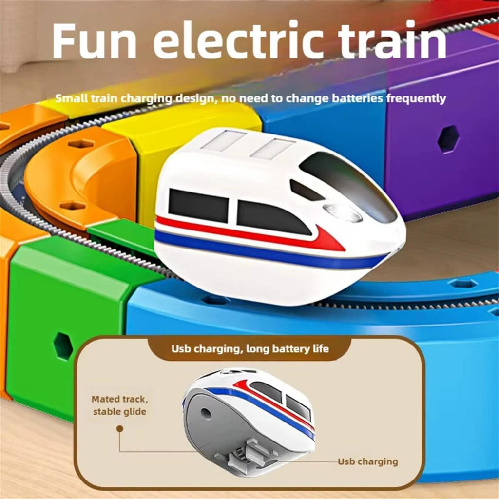 Colorful toy electric train set with a small train on a track, featuring text about USB charging and long battery life.
