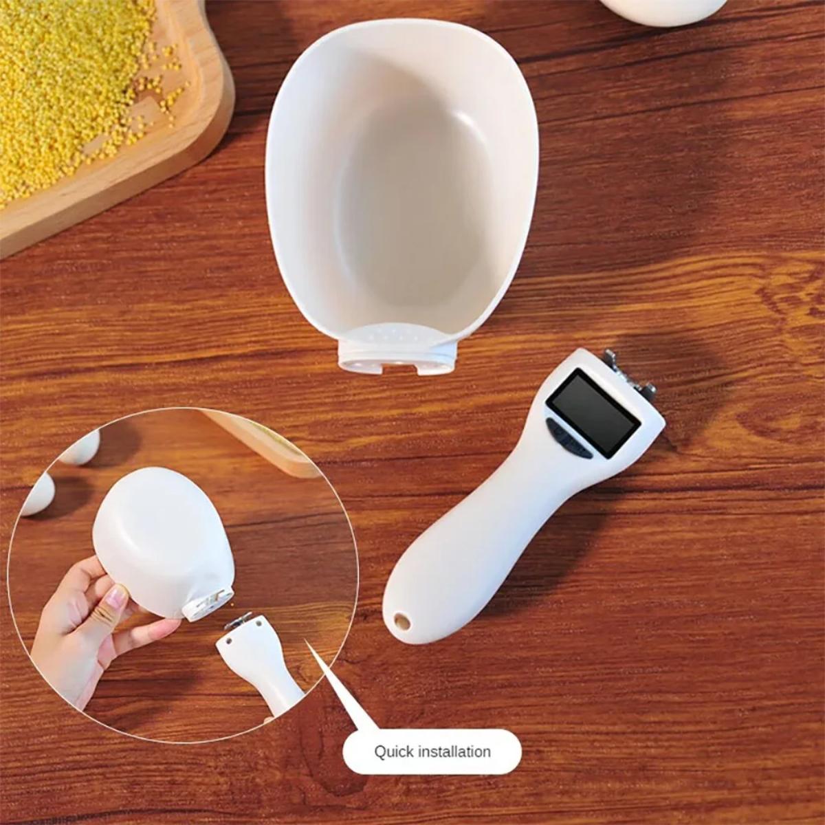 White kitchen tool with a digital display on a wooden surface, showing installation process.