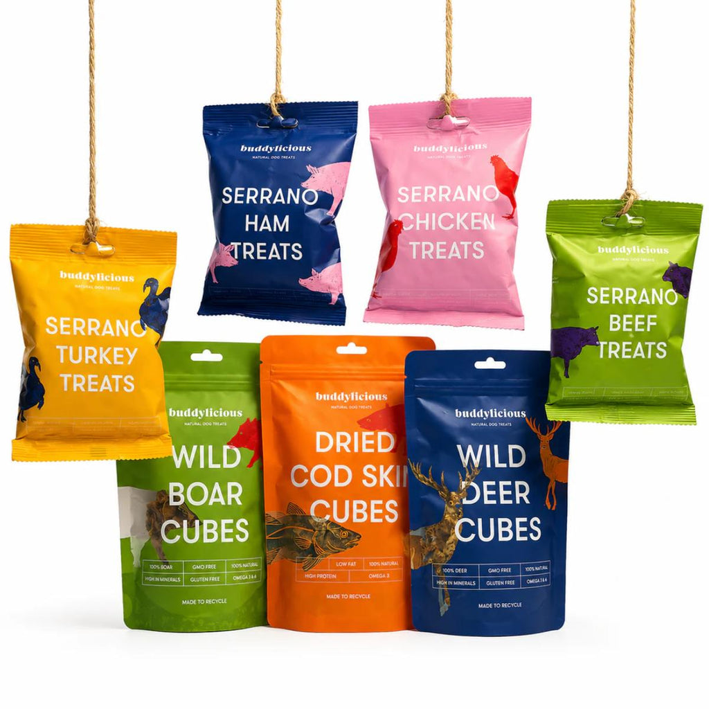 Buddylicious Training Treats Bundle with seven varieties of natural dog training treats including Serrano meats, wild deer, wild boar and cod skin cubes