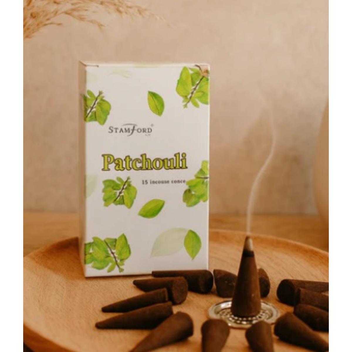 Patchouli incense cones arranged on a surface, releasing warm earthy fragrance.