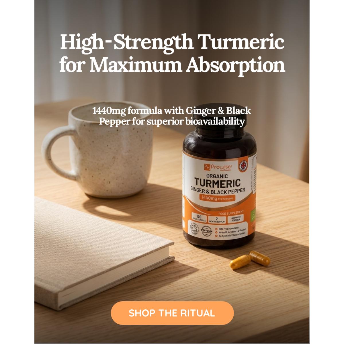 Turmeric supplement bottle with capsules and a mug on a wooden surface, promoting high-strength turmeric for maximum absorption.
