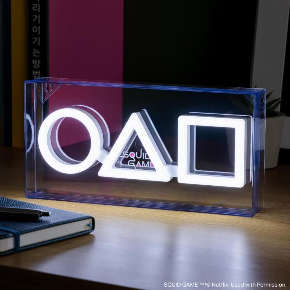 Squid Game LED neon light glowing in bright colors, designed as a decorative room lamp.